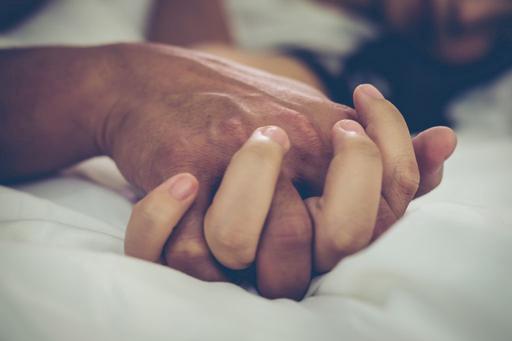 man and woman's hands holding