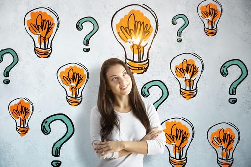 woman with light bulbs and question marks around her