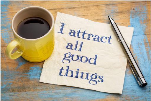 a drink with a notepad saying i attract all good things
