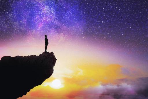 colourful night sky with person staring at it