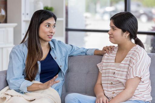 two woman in conversation