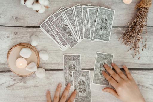 tarot card deck laid out on table
