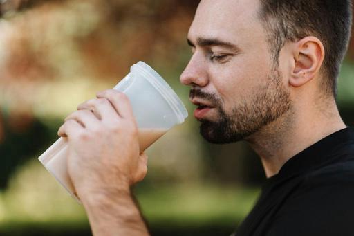 man drinking protein shake